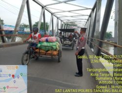 Personel Satlantas Polres Tanjung Balai Melaksanakan Kegiatan Pengaturan Lalu Lintas Padat Pagi