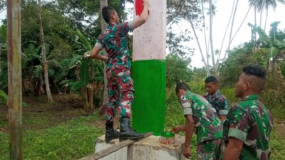 Wujudkan Keindahan Kampung Perbatasan Papua Satgas Yonif 123/RW Cat Ulang Gapura